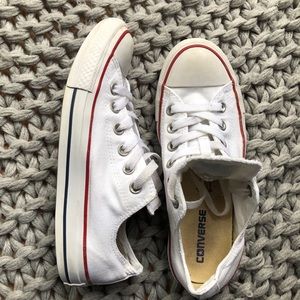 Low top white Converse with red and blue stripe
